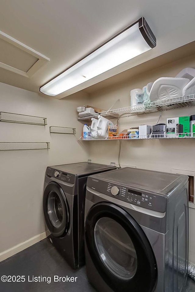 laundry room with separate washer and dryer and baseboards