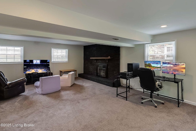 carpeted office space with a fireplace, plenty of natural light, baseboards, and recessed lighting