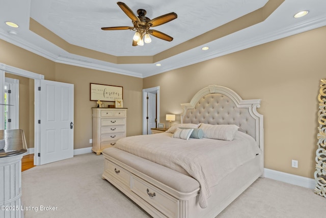 bedroom featuring a raised ceiling, light colored carpet, ornamental molding, recessed lighting, and baseboards