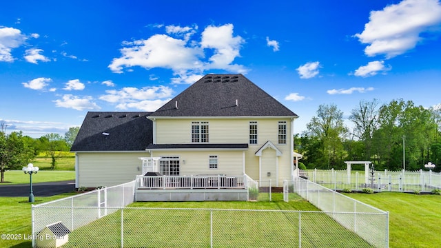 rear view of property with a wooden deck