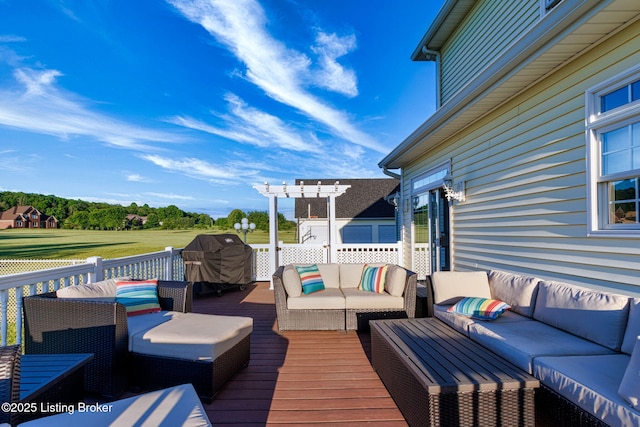 deck featuring an outdoor living space and area for grilling