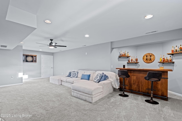 living area featuring carpet, a dry bar, recessed lighting, baseboards, and a ceiling fan
