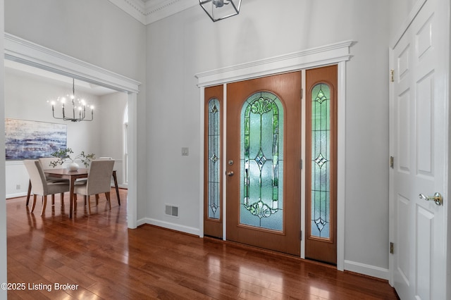 10304 Spring Meyer Rd, Louisville, KY 40223 - foyer featuring a chandelier, a high ceiling, wood-type flooring, baseboards, and ornamental molding