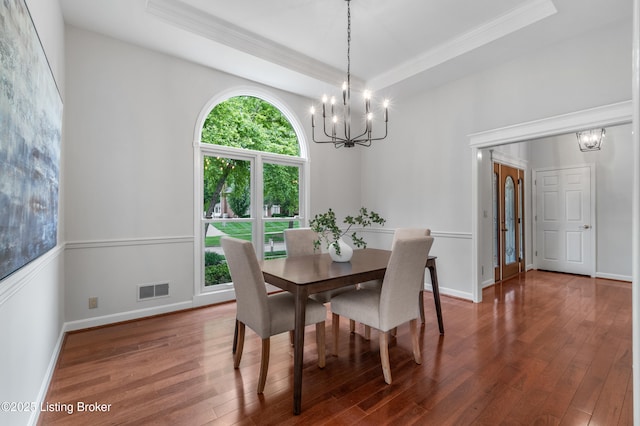 10304 Spring Meyer Rd, Louisville, KY 40223 - dining room with a chandelier, crown molding, wood finished floors, a tray ceiling, and baseboards