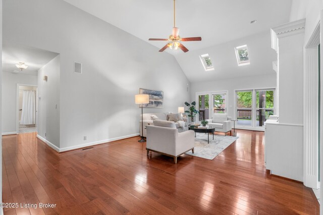 10304 Spring Meyer Rd, Louisville, KY 40223 - living room with a skylight, a ceiling fan, high vaulted ceiling, hardwood / wood-style floors, and baseboards