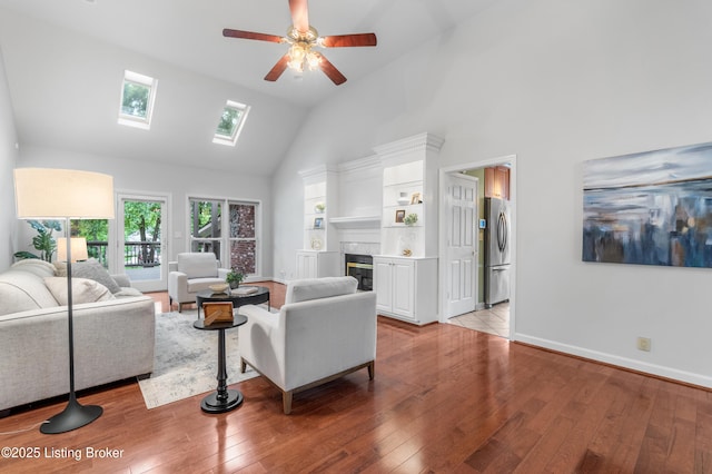 10304 Spring Meyer Rd, Louisville, KY 40223 - living room featuring high vaulted ceiling, ceiling fan, hardwood / wood-style flooring, a skylight, and baseboards
