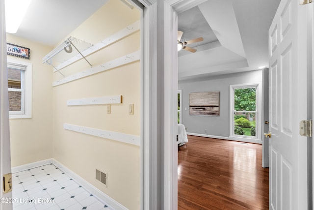 10304 Spring Meyer Rd, Louisville, KY 40223 - hallway featuring baseboards, a raised ceiling, and wood finished floors