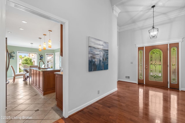 10304 Spring Meyer Rd, Louisville, KY 40223 - entryway with a chandelier, ornamental molding, baseboards, and a towering ceiling