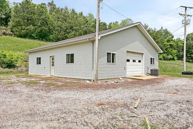 198 Mill Creek Ln, Bardstown, KY 40004 - view of property exterior featuring central AC unit, a detached garage, and an outdoor structure