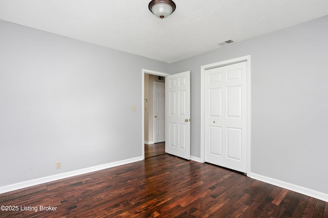 198 Mill Creek Ln, Bardstown, KY 40004 - unfurnished bedroom featuring dark wood-style flooring, baseboards, and a closet