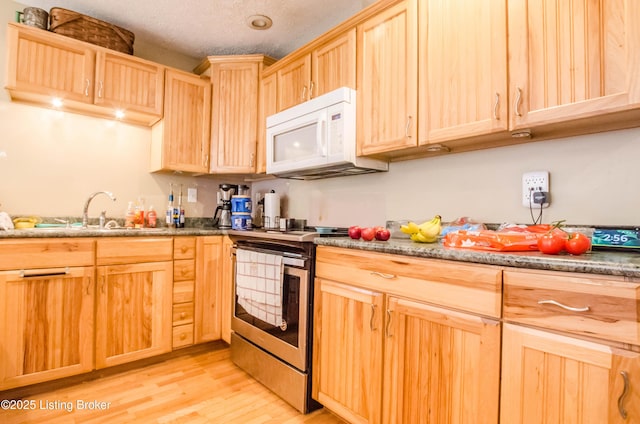 562 Peaceful Way, Shepherdsville, KY 40165 - kitchen featuring white microwave, light brown cabinets, stainless steel range with electric cooktop, a sink, and light wood finished floors