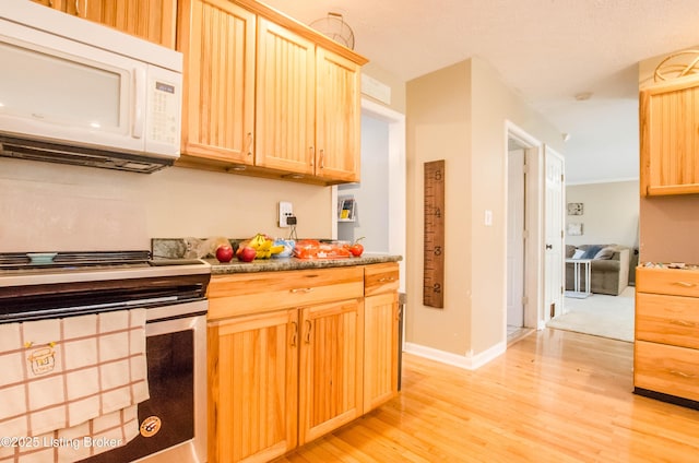 562 Peaceful Way, Shepherdsville, KY 40165 - kitchen with white microwave, stainless steel range with electric cooktop, light brown cabinets, light wood-style flooring, and baseboards