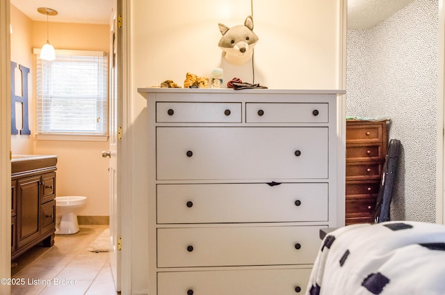 562 Peaceful Way, Shepherdsville, KY 40165 - bedroom featuring light tile patterned floors, baseboards, and ensuite bath