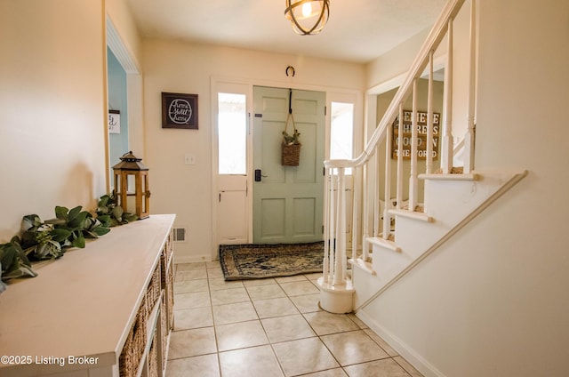 562 Peaceful Way, Shepherdsville, KY 40165 - foyer entrance with stairway, light tile patterned floors, and baseboards