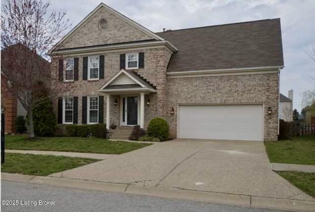 4313 Brownsboro Glen Rd, Louisville, KY 40241 - view of front of property featuring concrete driveway, a front yard, and a garage