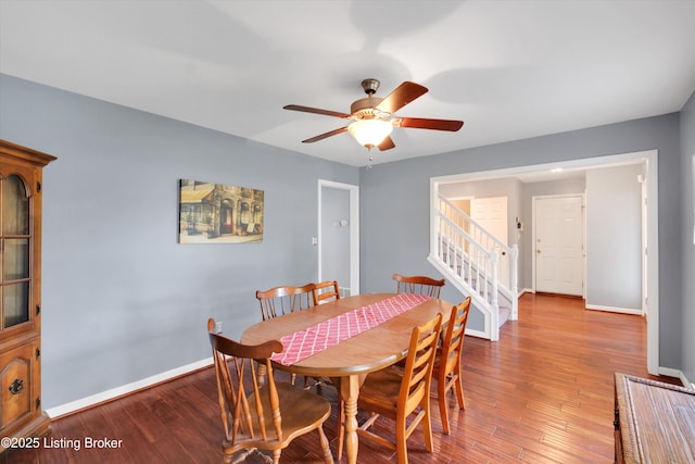 4313 Brownsboro Glen Rd, Louisville, KY 40241 - dining room with stairs, baseboards, a ceiling fan, and wood finished floors
