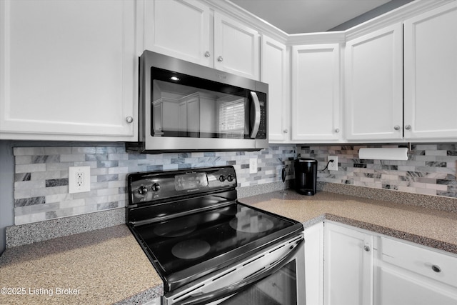 4313 Brownsboro Glen Rd, Louisville, KY 40241 - kitchen featuring stainless steel microwave, black electric range oven, white cabinets, and tasteful backsplash