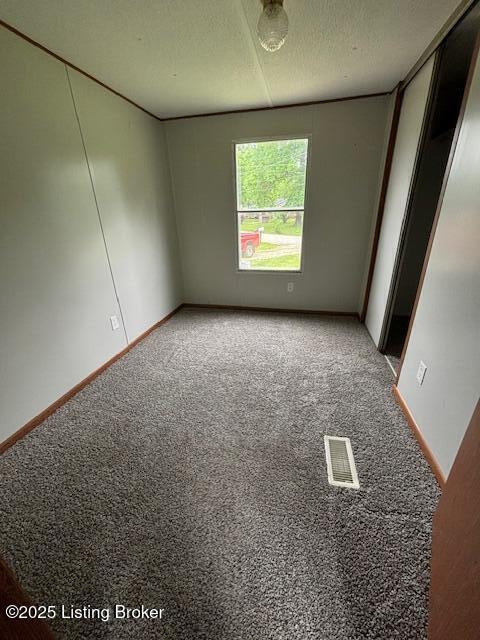 345 Hemlock Dr, Shepherdsville, KY 40165 - carpeted spare room featuring baseboards and a textured ceiling