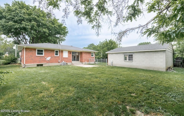 3009 Huberta Dr, Louisville, KY 40216 - back of property with entry steps, brick siding, and central air condition unit