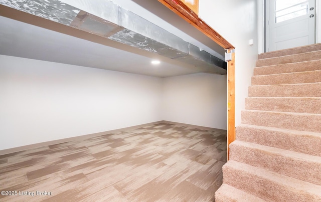 3009 Huberta Dr, Louisville, KY 40216 - below grade area with stairway and wood finished floors