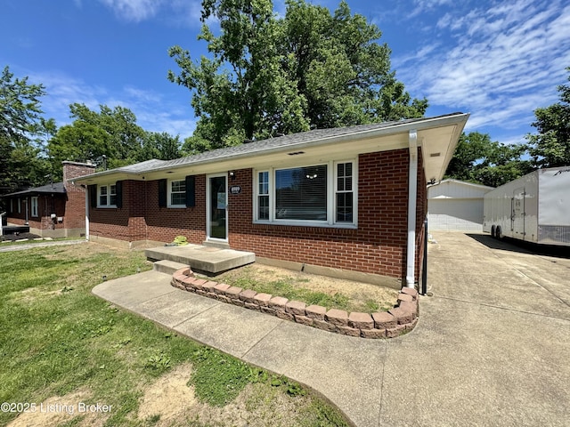 4919 Ferrer Way, Louisville, KY 40291 - single story home featuring brick siding, concrete driveway, an outbuilding, and a front yard