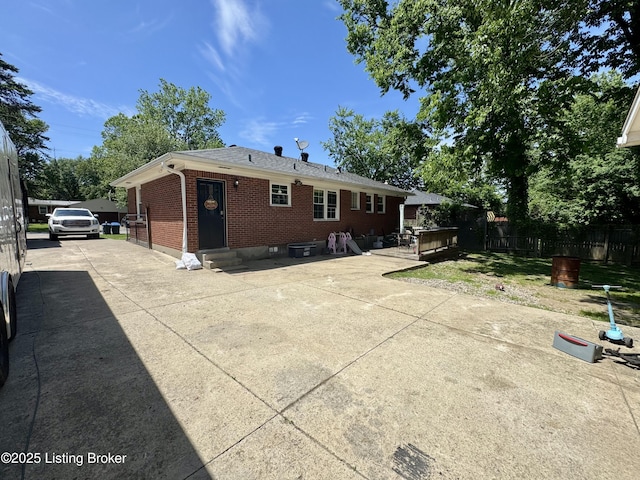 4919 Ferrer Way, Louisville, KY 40291 - rear view of property featuring brick siding, fence, and entry steps