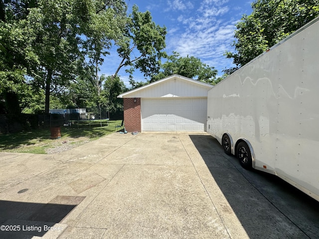 4919 Ferrer Way, Louisville, KY 40291 - detached garage featuring a trampoline