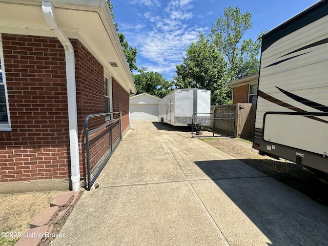 4919 Ferrer Way, Louisville, KY 40291 - view of home's exterior featuring brick siding, fence, and a garage