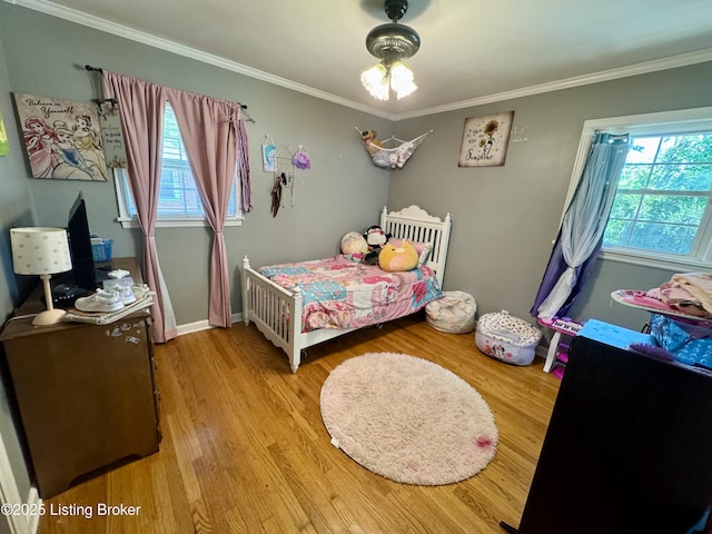 4919 Ferrer Way, Louisville, KY 40291 - bedroom featuring multiple windows, crown molding, wood finished floors, and baseboards