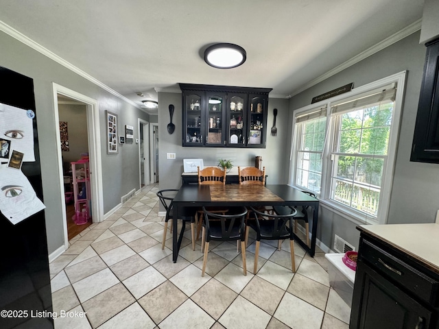 4919 Ferrer Way, Louisville, KY 40291 - dining area featuring crown molding, baseboards, and light tile patterned flooring
