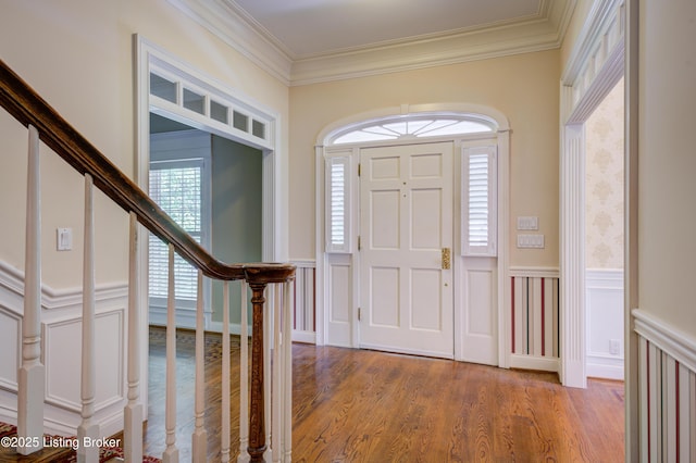 5302 Olde Creek Way, Prospect, KY 40059 - foyer with crown molding, light wood-style flooring, a wainscoted wall, a decorative wall, and stairway