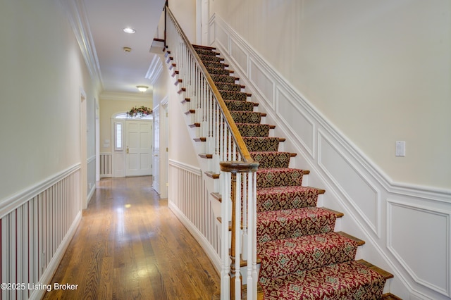 5302 Olde Creek Way, Prospect, KY 40059 - stairway with a decorative wall, ornamental molding, wood finished floors, and a wainscoted wall