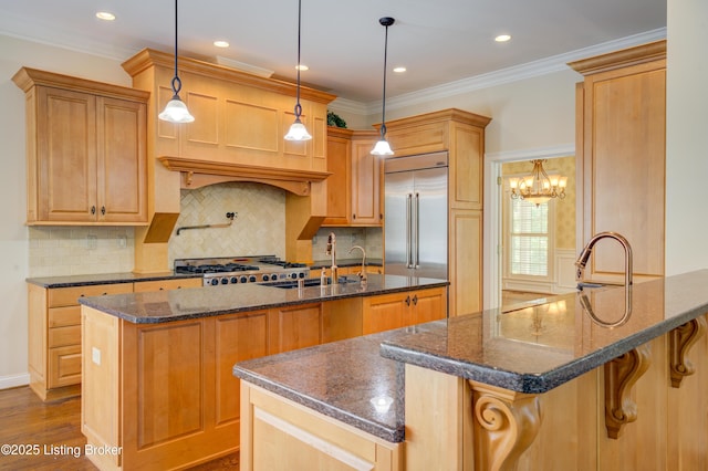 5302 Olde Creek Way, Prospect, KY 40059 - kitchen featuring a sink, stainless steel built in refrigerator, range, a breakfast bar, and a center island with sink