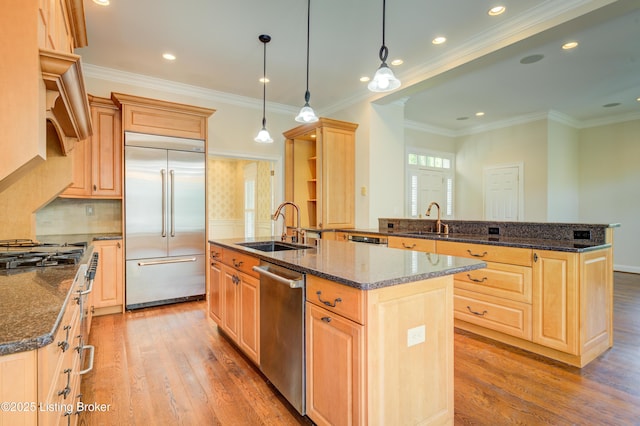 5302 Olde Creek Way, Prospect, KY 40059 - kitchen with stainless steel appliances, a sink, light brown cabinets, an island with sink, and crown molding