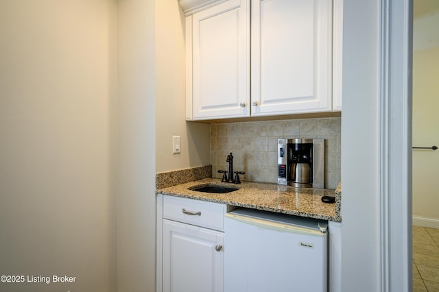 5302 Olde Creek Way, Prospect, KY 40059 - kitchen featuring a sink, dishwasher, backsplash, white cabinetry, and light stone countertops