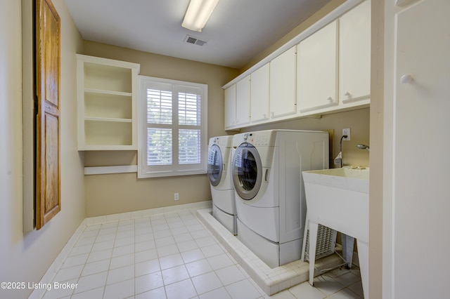 5302 Olde Creek Way, Prospect, KY 40059 - laundry room featuring washer and clothes dryer, cabinet space, and light tile patterned floors