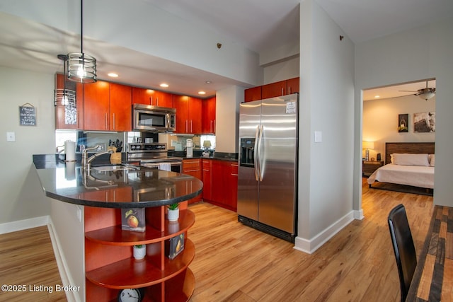 604 S 3rd St Unit 803, Louisville, KY 40202 - kitchen featuring appliances with stainless steel finishes, open shelves, a peninsula, baseboards, and recessed lighting