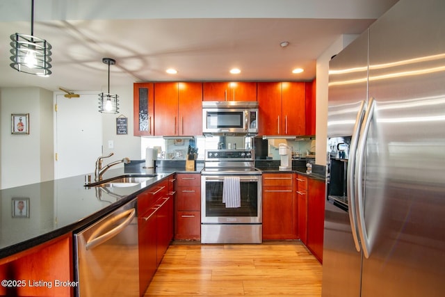 604 S 3rd St Unit 803, Louisville, KY 40202 - kitchen with stainless steel appliances, a sink, light wood-type flooring, pendant lighting, and recessed lighting