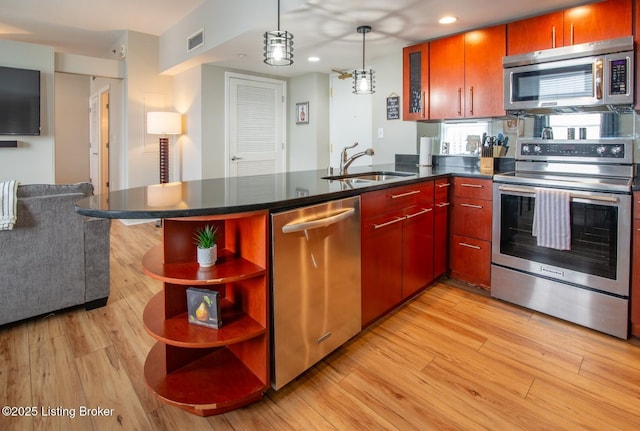 604 S 3rd St Unit 803, Louisville, KY 40202 - kitchen featuring appliances with stainless steel finishes, a sink, open shelves, light wood finished floors, and recessed lighting