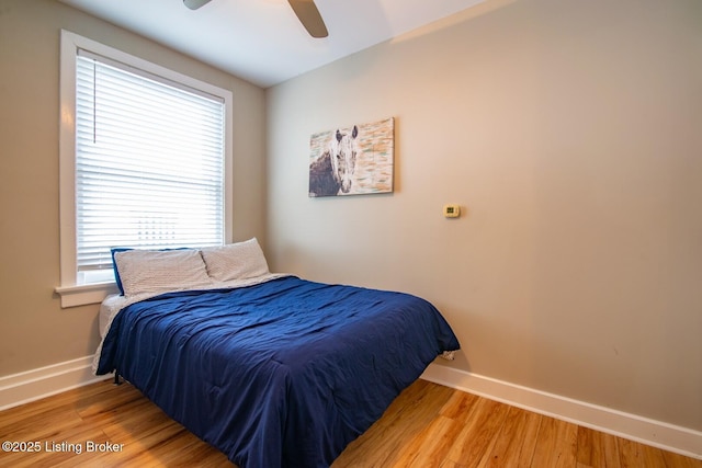 604 S 3rd St Unit 803, Louisville, KY 40202 - bedroom with baseboards, wood finished floors, and a ceiling fan