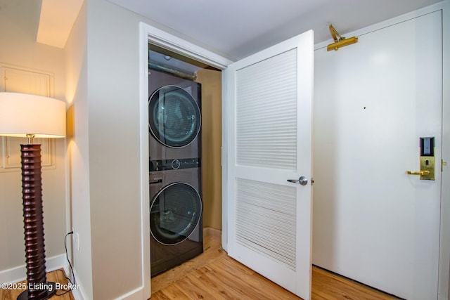 604 S 3rd St Unit 803, Louisville, KY 40202 - washroom with estacked washer and dryer and wood finished floors