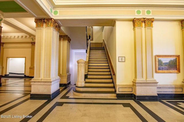 604 S 3rd St Unit 803, Louisville, KY 40202 - stairs featuring inlaid floor details, decorative columns, and ornamental molding