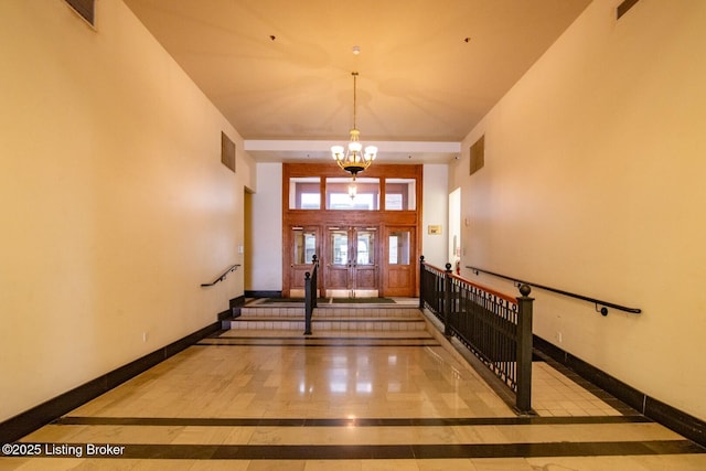 604 S 3rd St Unit 803, Louisville, KY 40202 - foyer featuring inlaid floor details, a chandelier, and baseboards
