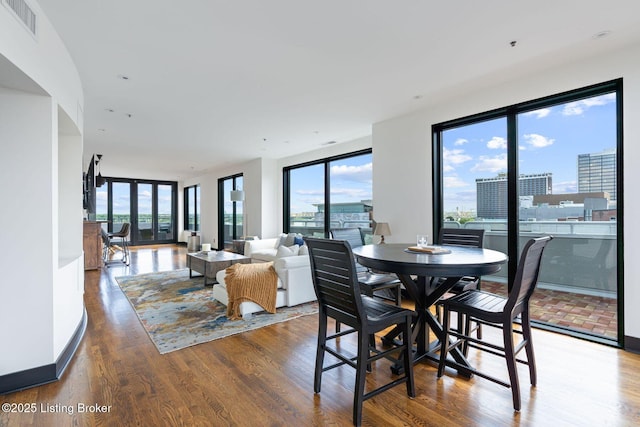 711 W Main St Unit T, Louisville, KY 40202 - dining room with healthy amount of natural light and wood finished floors