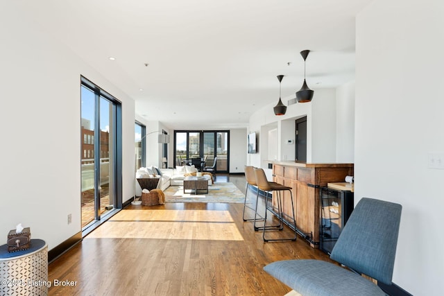 711 W Main St Unit T, Louisville, KY 40202 - living area with wood finished floors and wine cooler