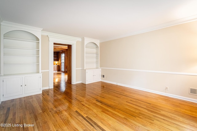 3920 Elfin Ave, Louisville, KY 40207 - unfurnished room with wood finished floors, baseboards, built in features, and crown molding
