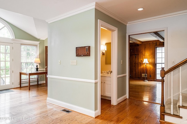 3920 Elfin Ave, Louisville, KY 40207 - corridor with light wood-type flooring, stairway, a sink, ornamental molding, and baseboards