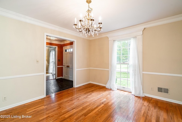 3920 Elfin Ave, Louisville, KY 40207 - spare room featuring a chandelier, baseboards, hardwood / wood-style floors, and ornamental molding