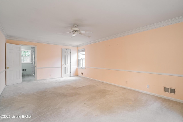 3920 Elfin Ave, Louisville, KY 40207 - unfurnished room featuring ornamental molding, a ceiling fan, healthy amount of natural light, baseboards, and light carpet