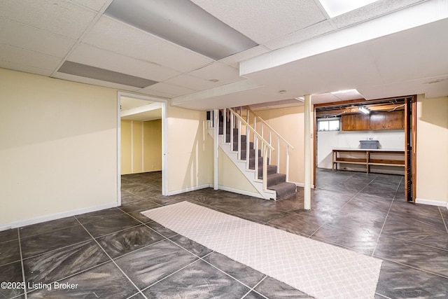 3920 Elfin Ave, Louisville, KY 40207 - basement with stairway, a drop ceiling, and baseboards